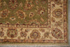 Load image into Gallery viewer, A close-up of an ornate traditional area rug showing its corner and border details. The rug features a muted olive green field with a beige inner border and a wide cream border decorated with floral motifs in brown, rust, and teal.