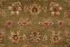 Load image into Gallery viewer, A close-up of a traditional patterned rug with an olive green background and ornate floral motifs in beige, rust red, and light blue.