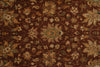 Load image into Gallery viewer, A close-up of a traditional patterned rug with a dark brown background and beige, tan, and muted green floral motifs.