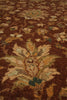 Load image into Gallery viewer, A close-up of a traditional patterned area rug with a rich brown base and ornate floral motifs in beige, muted green, and ochre orange.