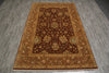 Load image into Gallery viewer, A traditional oriental area rug with a dark brown center and ornate floral patterns in beige, gold, and muted green, laid out on a gray wood-look floor.