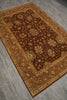 Load image into Gallery viewer, A rectangular traditional area rug with an intricate floral and vine pattern, shown from an elevated angle on a gray wood-look floor. The rug features a dark brown center field, a golden-brown border, and small light accents.