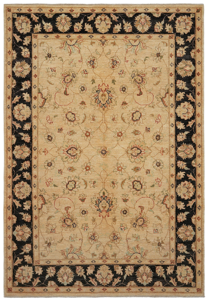 A traditional oriental-style area rug with a beige center field, black floral borders, and muted accents of red, blue, and green in the pattern.
