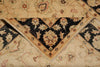 Load image into Gallery viewer, A close-up of a folded traditional patterned rug showing a cream and black floral design with beige and rust accents.