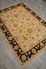 Load image into Gallery viewer, A rectangular area rug with a beige center and a black floral border, laid out on a gray wood-look floor.