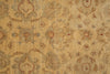 Load image into Gallery viewer, A close-up of a vintage-style area rug featuring a distressed, faded floral and scroll pattern in beige, tan, muted blue-gray, and rust red.