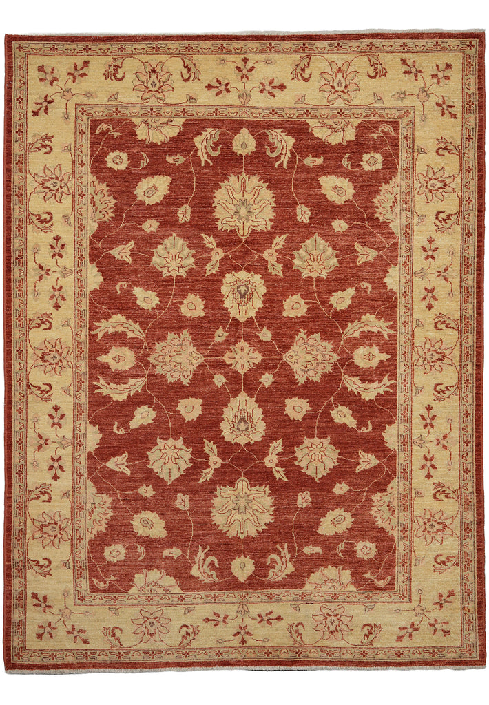 A traditional oriental-style area rug with a deep red central field and a warm beige border, featuring an intricate floral and vine pattern.