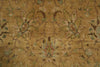 Load image into Gallery viewer, A close-up of a traditional patterned rug with a warm tan and beige background, featuring muted green, brown, and light blue floral motifs.