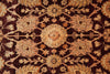 Load image into Gallery viewer, A close-up of an ornate traditional rug featuring a symmetrical floral and medallion pattern in warm beige, tan, and rust tones over a very dark brown to near-black background.