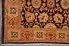 Load image into Gallery viewer, A close-up of an ornate patterned rug corner showing a dark burgundy field with beige floral motifs and a warm rust-orange border.