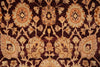 Load image into Gallery viewer, A close-up of a traditional patterned rug with a dark brown background and beige, tan, and muted orange floral and geometric motifs.