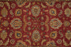 Load image into Gallery viewer, A close-up of an ornate traditional rug with a deep red field and intricate floral motifs in beige, blue, and muted green.
