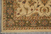 Load image into Gallery viewer, Close-up of a traditional oriental rug corner showing a beige field, olive green border, and floral motifs in muted red, blue, and brown tones.