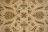Load image into Gallery viewer, A close-up of a woven textile or rug pattern with a beige background and ornate floral motifs in muted green, rust red, mustard yellow, and brown.