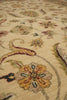 Load image into Gallery viewer, Close-up of a traditional patterned area rug with a warm beige background and floral motifs in muted orange, green, burgundy, and blue.