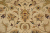 Load image into Gallery viewer, Close-up of an ornate floral rug pattern in warm beige, tan, muted green, and brown tones, showing detailed woven texture and symmetrical botanical motifs.