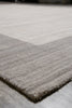 Load image into Gallery viewer, Close-up of a textured area rug corner showing a light gray and taupe striped pattern on a gray floor.