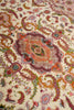 Load image into Gallery viewer, Close-up weave detail of the Persian Tabriz rug medallion, showing fine hand-knotted wool and silk pile in pink, orange, and green paisley motifs