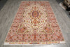 Load image into Gallery viewer, Full view of the 6.7 x 10.3 hand-knotted Persian Tabriz rug laid flat, showing the ivory field, floral border, and woven signature panel