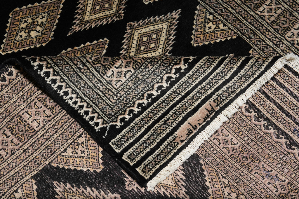 Close-up of a patterned rug with geometric designs.