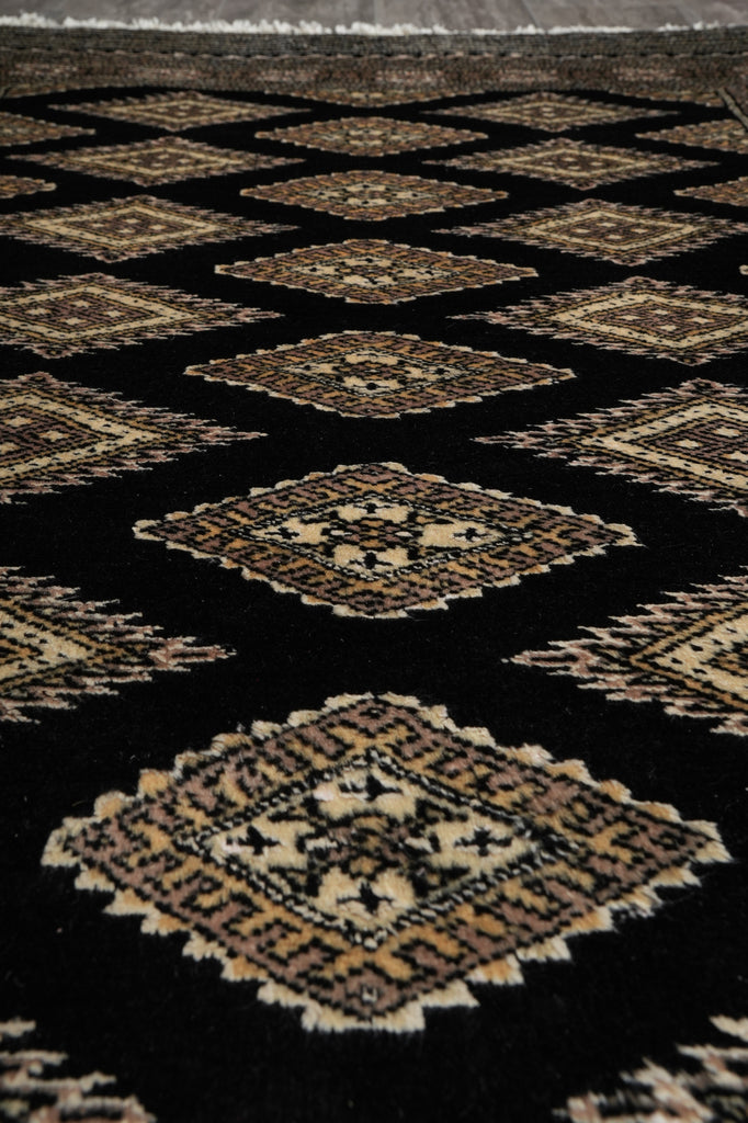 Close-up of a textured fabric with diamond pattern on a black background
