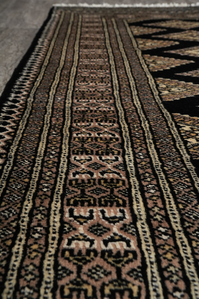 Close-up of a patterned rug with intricate designs.
