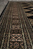 Load image into Gallery viewer, Close-up of a patterned rug with intricate designs.