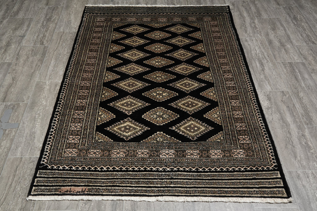 Decorative rug with geometric pattern on a wooden floor