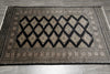 Load image into Gallery viewer, Decorative rug with geometric pattern on a wooden floor