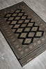 Load image into Gallery viewer, Decorative rug with geometric pattern on a wooden floor
