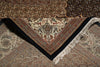 Load image into Gallery viewer, Close-up of a patterned rug with intricate designs and fringes.