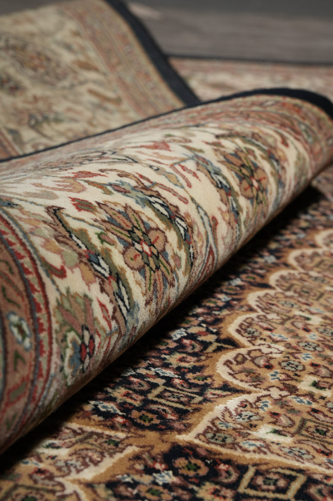 Close-up of a patterned rug with intricate designs.