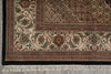 Load image into Gallery viewer, Close-up of a patterned rug with intricate designs and fringes.
