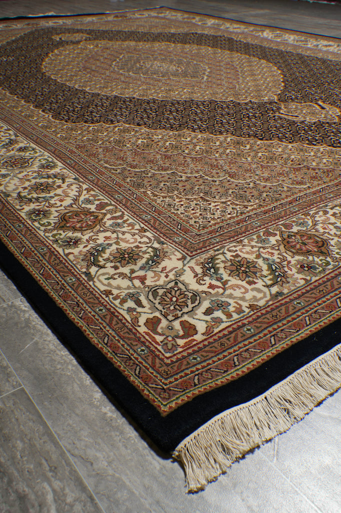 Decorative rug with intricate patterns on a gray floor