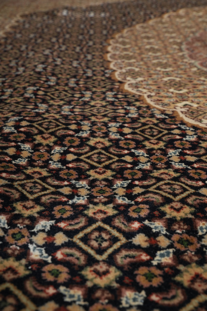 Close-up of a patterned rug with intricate designs.