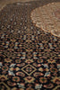 Load image into Gallery viewer, Close-up of a patterned rug with intricate designs.