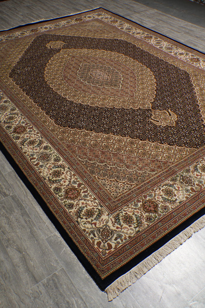 Decorative rug with intricate patterns on a wooden floor