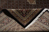 Load image into Gallery viewer, Close-up of a patterned rug with intricate designs and a prominent V-shaped design.