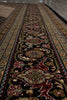 Load image into Gallery viewer, Decorative patterned rug with intricate designs on a wooden floor.