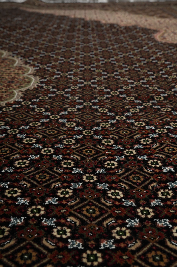 Close-up of a patterned rug with intricate designs.