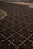 Load image into Gallery viewer, Close-up of a patterned rug with intricate designs.