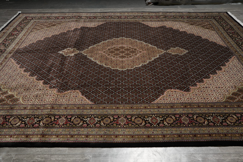 Decorative rug with intricate patterns on a wooden floor