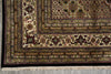 Load image into Gallery viewer, Close-up of a patterned rug with intricate designs on a concrete floor.
