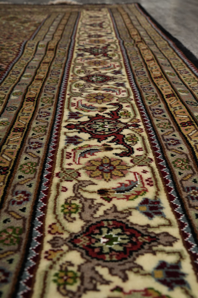 Close-up of a patterned rug with intricate designs.