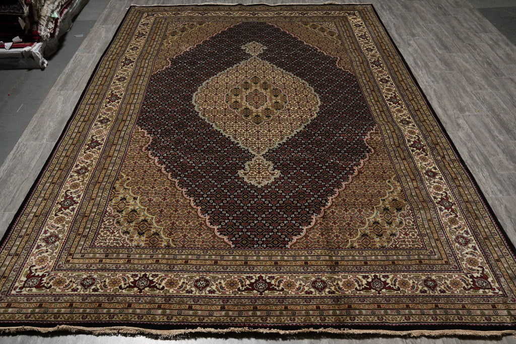 Decorative rug with intricate patterns on a wooden floor
