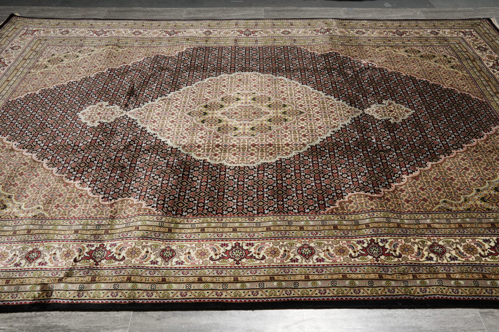 Decorative rug with intricate patterns on a wooden floor