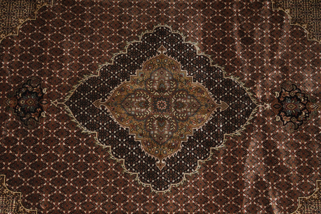 Close-up of a patterned rug with intricate designs.