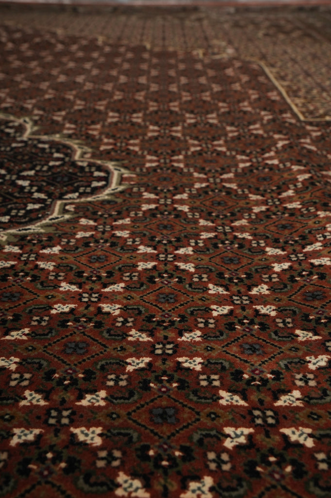 Close-up of a patterned rug with intricate designs.