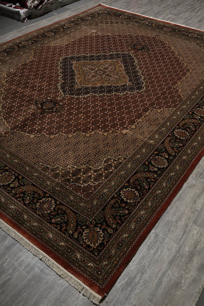 Decorative rug with intricate patterns on a gray floor