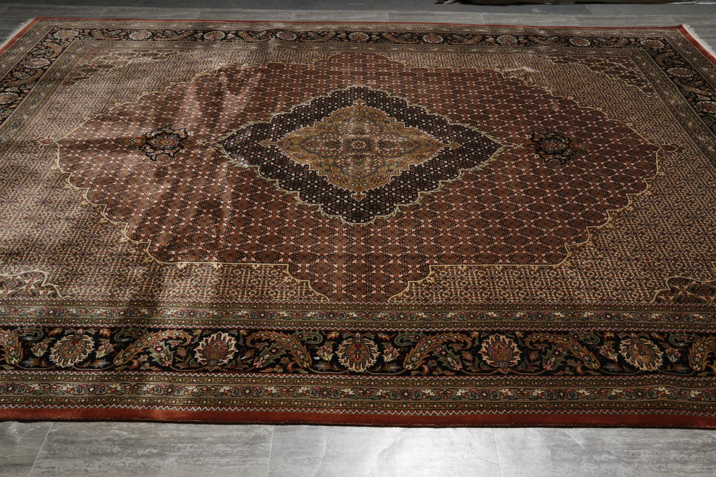 Decorative rug with intricate patterns on a wooden floor